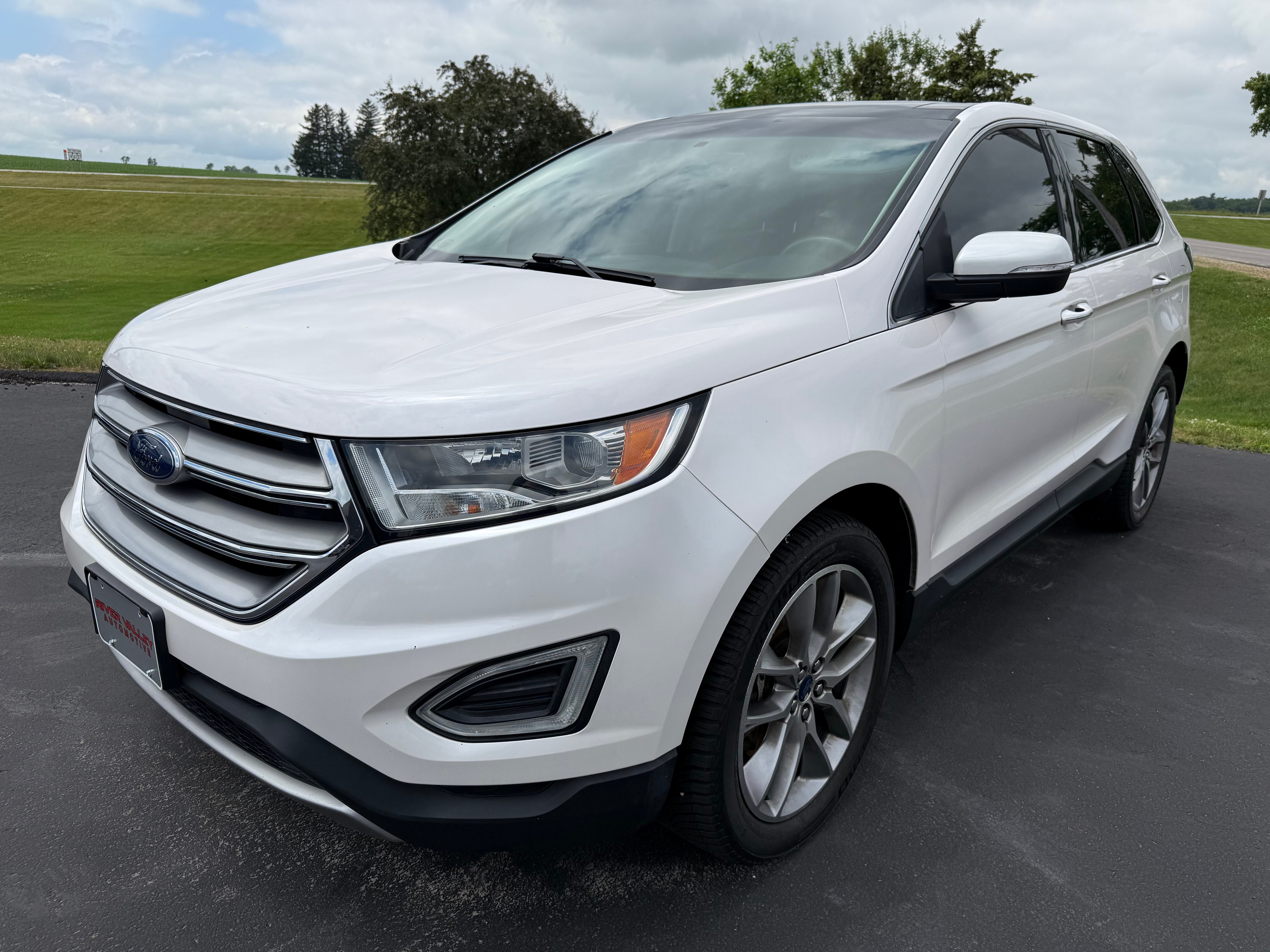 2017 Ford Edge Titanium in White — front three-quarter view